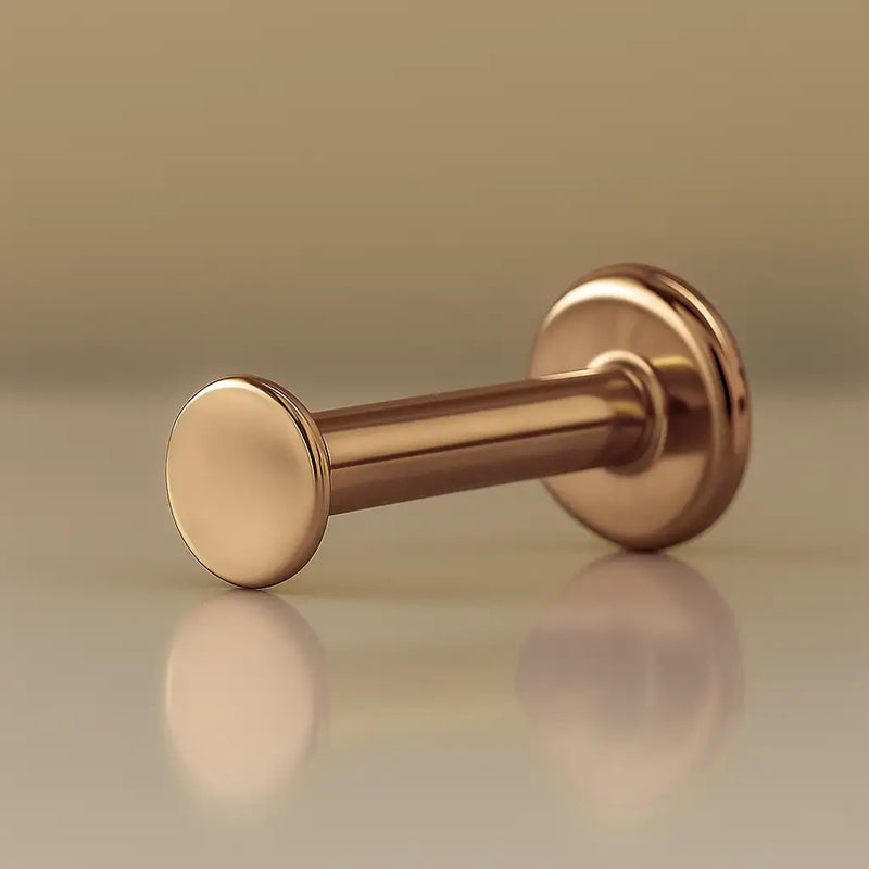 14K rose gold 2.5mm disc flat back labret stud, angled view showing post and flat disc backing
