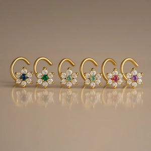 14K yellow gold CZ flower nose ring twist shown in six gemstone color options side by side