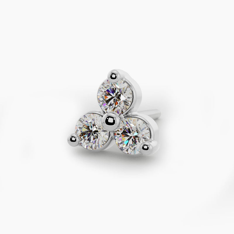 Close-up overhead view of 14k white gold trinity diamond nose stud end with three brilliant round diamonds