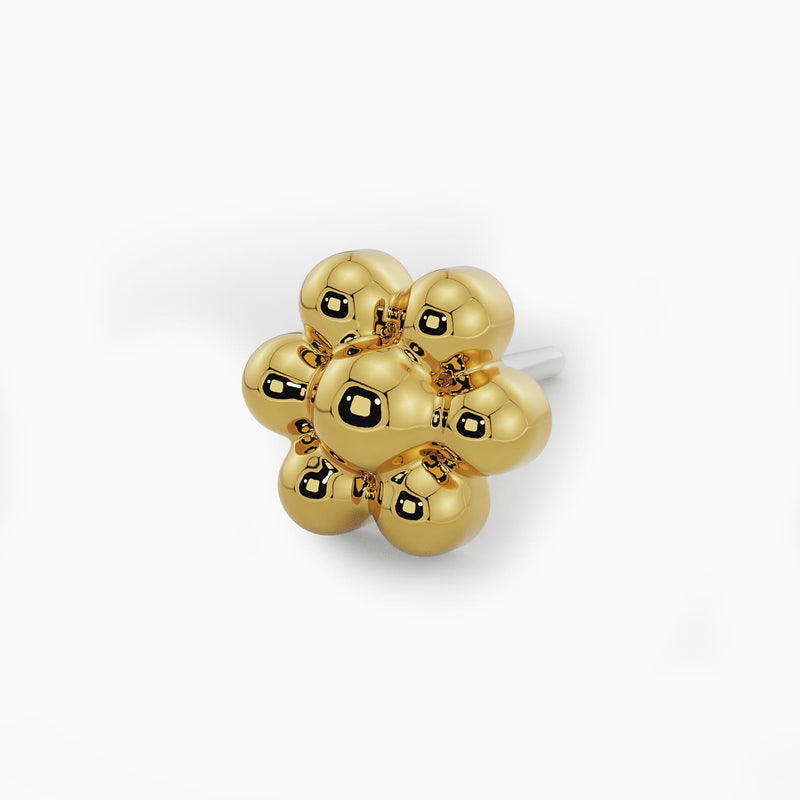 Macro close-up of 14k yellow gold beaded flower end on threadless pushpin post