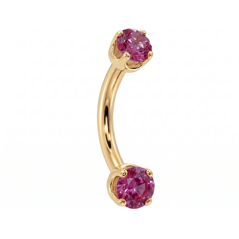 Dainty 2mm pink sapphire prong-set curved barbell in 14k yellow gold, 18 gauge, angled view