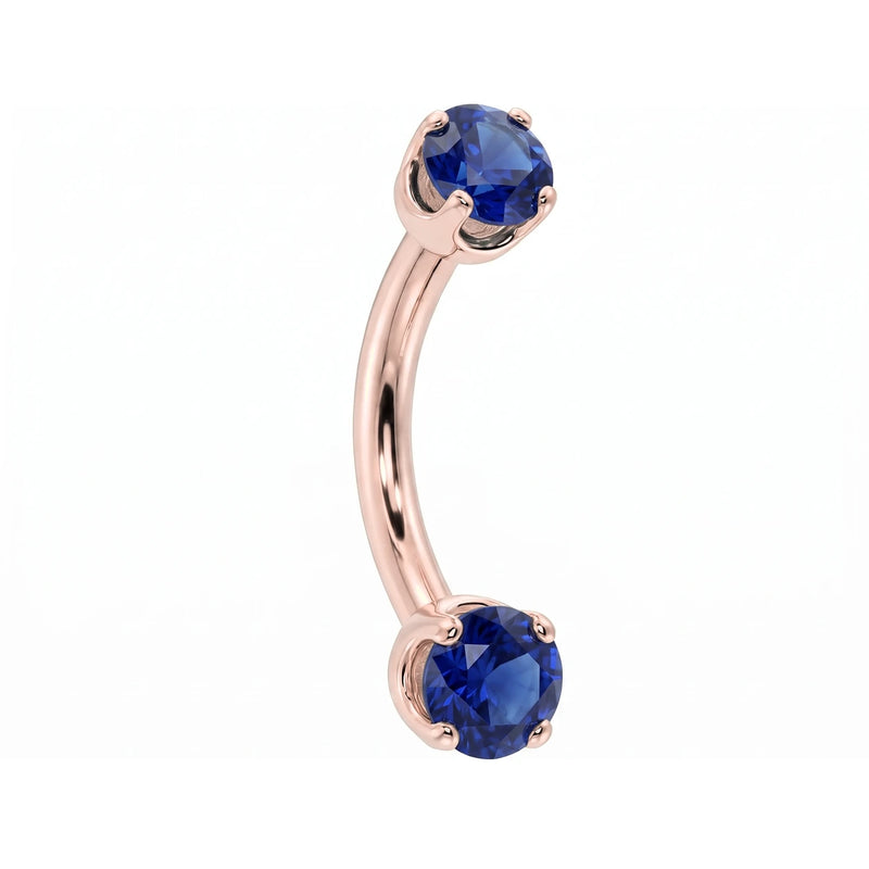 14k rose gold dainty 18G curved barbell with two 2mm round blue sapphires, angled view