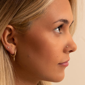 Diamond perlage nose stud shown in pierced nose on model, side profile demonstrating dainty fit