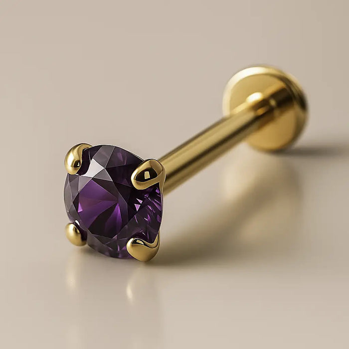 14K yellow gold flat back labret with 2mm prong-set amethyst, angled studio view showing post and disc