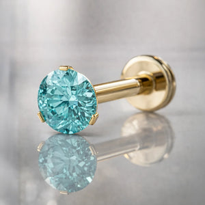 14k yellow gold 3mm aqua diamond flat back labret stud with reflective surface, angled hero shot
