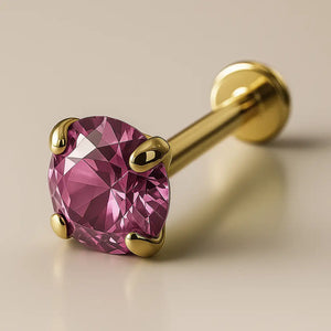 3mm pink sapphire flat back labret in 14K yellow gold with four-prong setting, angled studio view