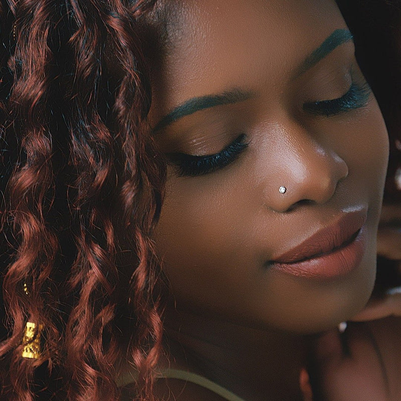 Diamond nose ring stud worn in piercing, close-up lifestyle shot showing subtle sparkle on model