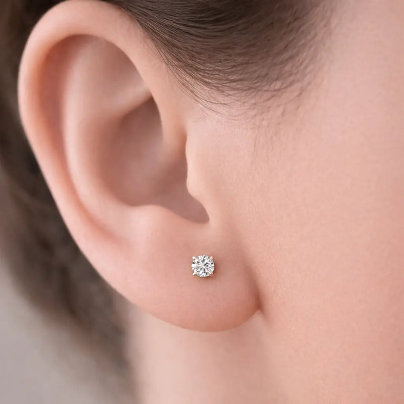 4mm diamond prong-set flat back earring worn in earlobe piercing, showing fit and scale
