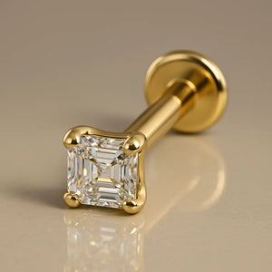 14k yellow gold Asscher-cut diamond flat back labret stud, angled studio shot showing post and disc
