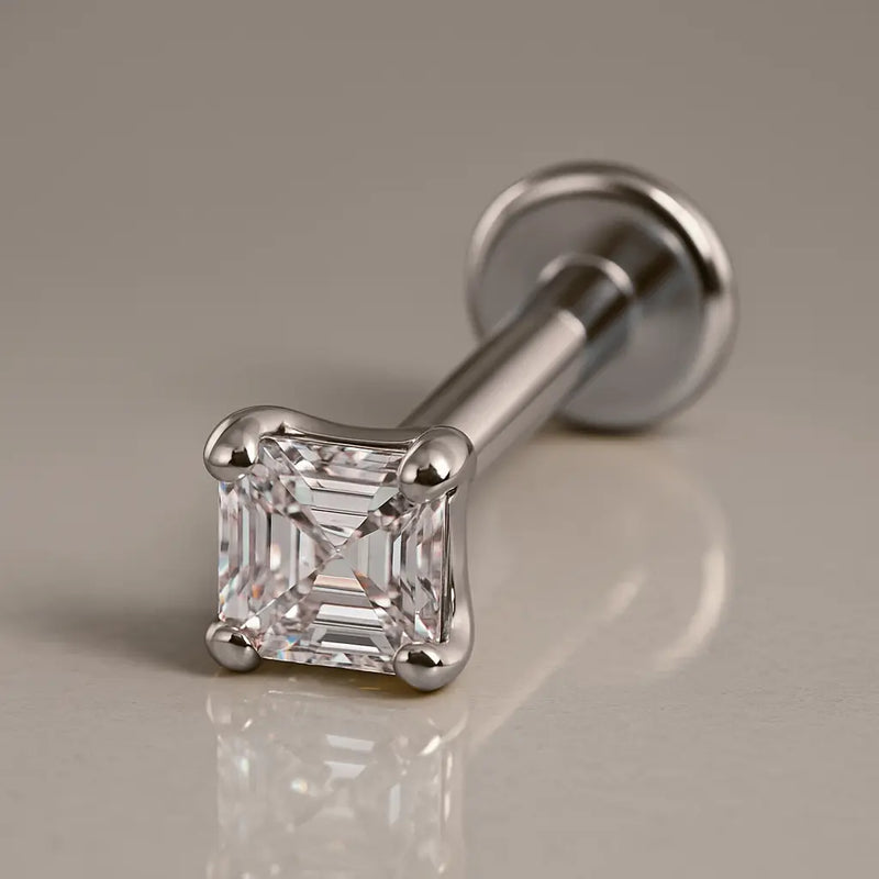14k white gold Asscher-cut diamond flat back labret stud, angled studio shot showing post and disc
