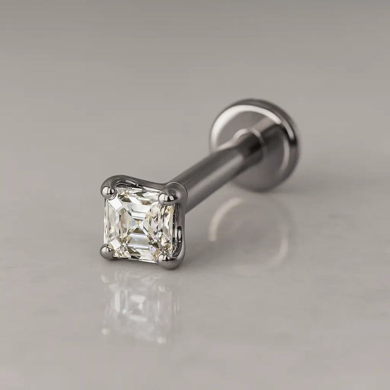 14k white gold 2mm Asscher-cut diamond flat back stud, angled shot on grey surface showing post and disc