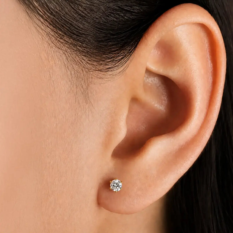 Close-up of an ear wearing Astra 6-prong 3.5mm diamond stud earring.