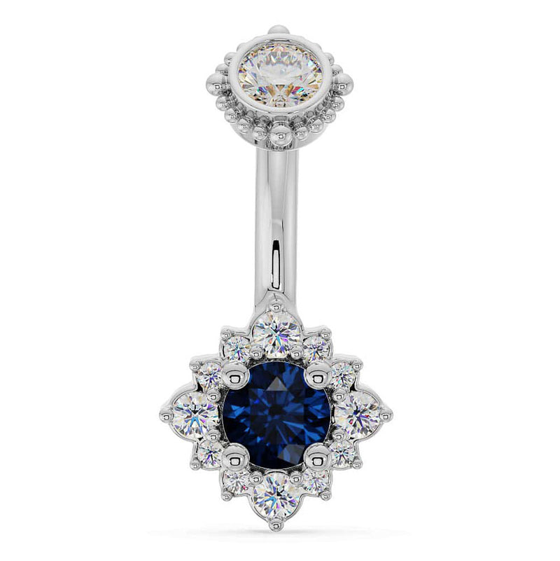 14k white gold belly ring with blue sapphire center stone surrounded by diamond halo flower setting