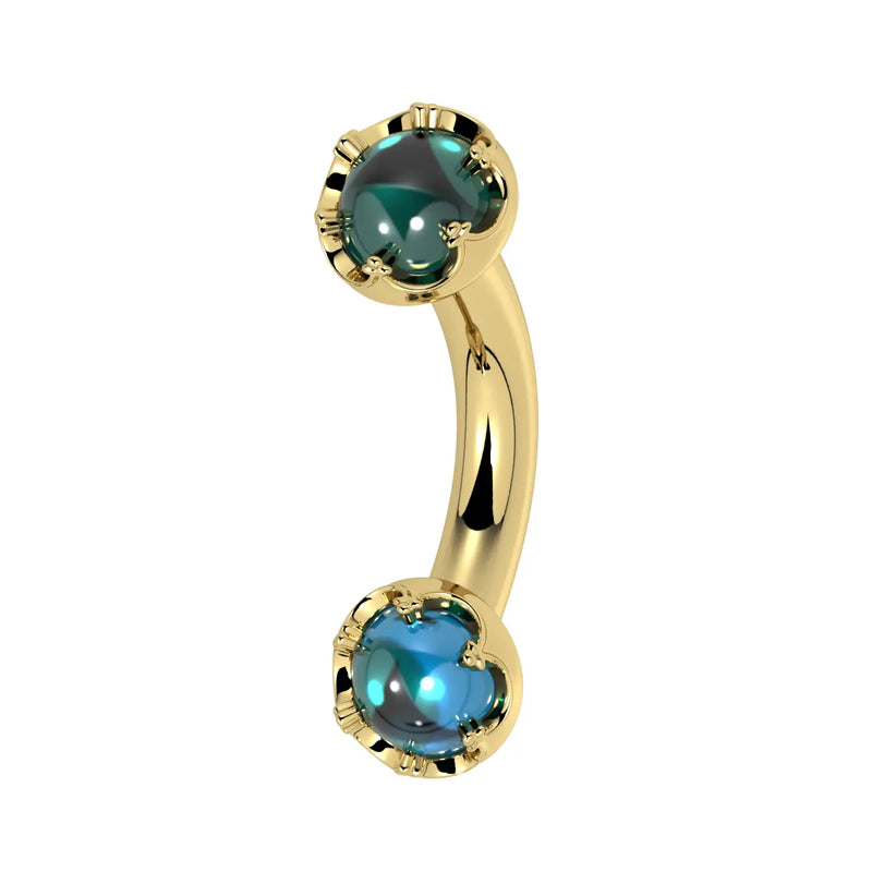 Reina London Blue Topaz Crown Curved Barbell in solid 14k gold, side view - for navel, rook, or eyebrow piercings