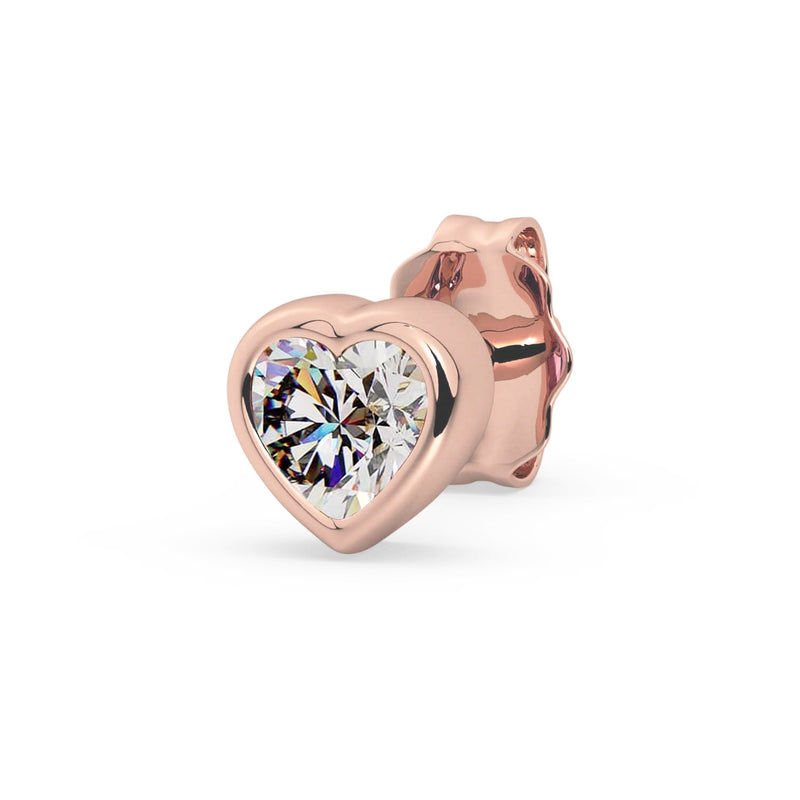 Single 14k rose gold diamond heart stud earring, angled view showing warm pink gold and brilliant stone