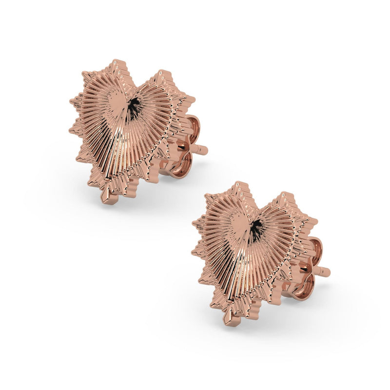 Pair of 14k rose gold radiant heart stud earrings displayed as matched set with spiked sunburst heart design