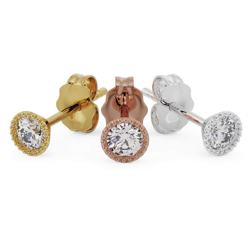 14K yellow, rose, and white gold milgrain CZ stud earrings displayed together, angled rear-facing view
