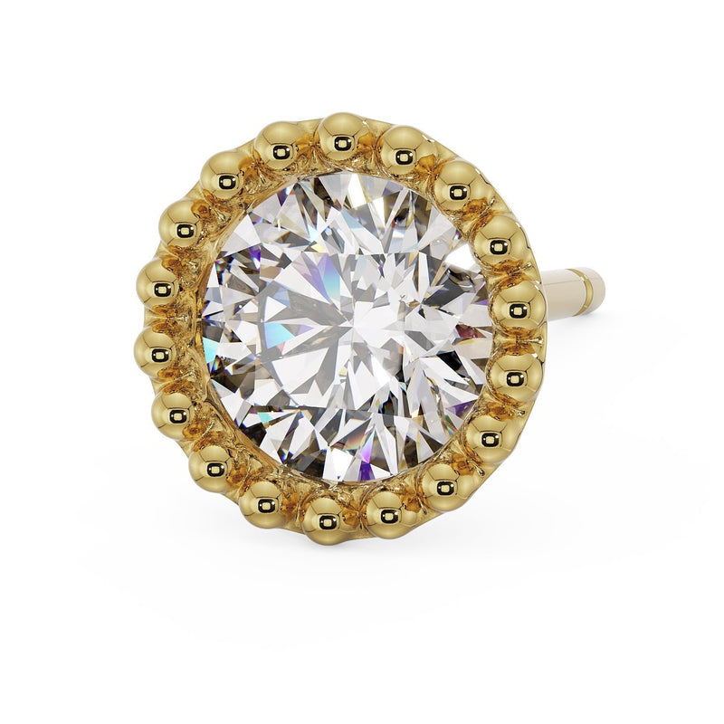 Close-up angled view of 14K yellow gold milgrain stud earring with large CZ and prominent beaded setting