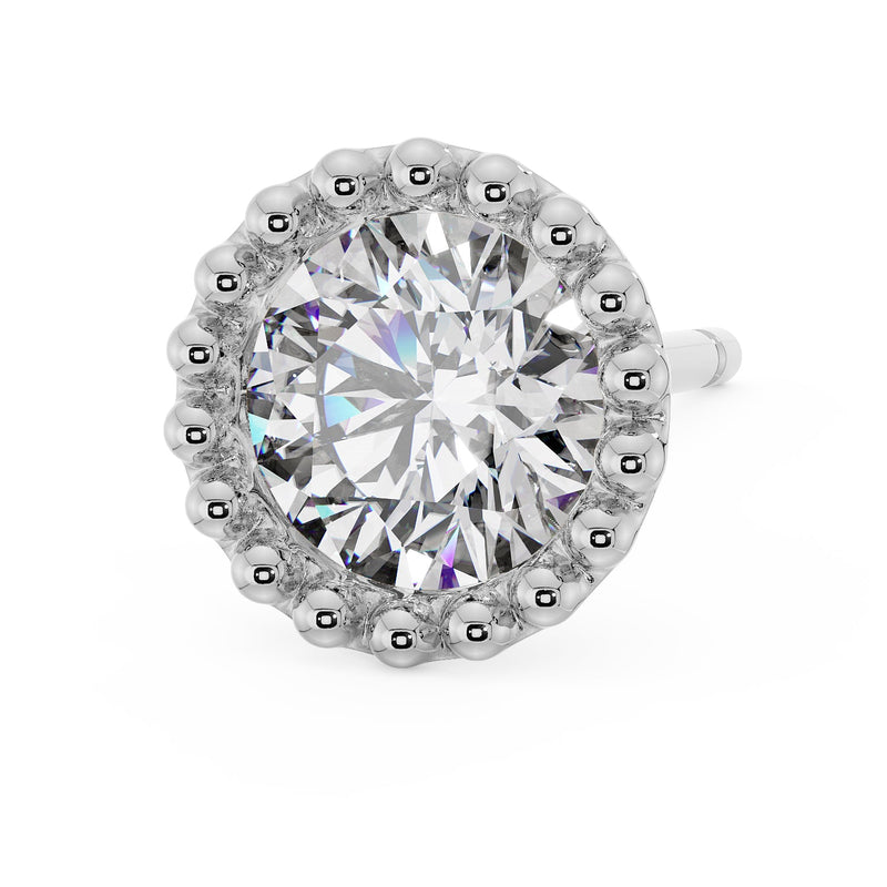Upper-angled view of 14K white gold milgrain stud with brilliant CZ and polished silver beaded milgrain border