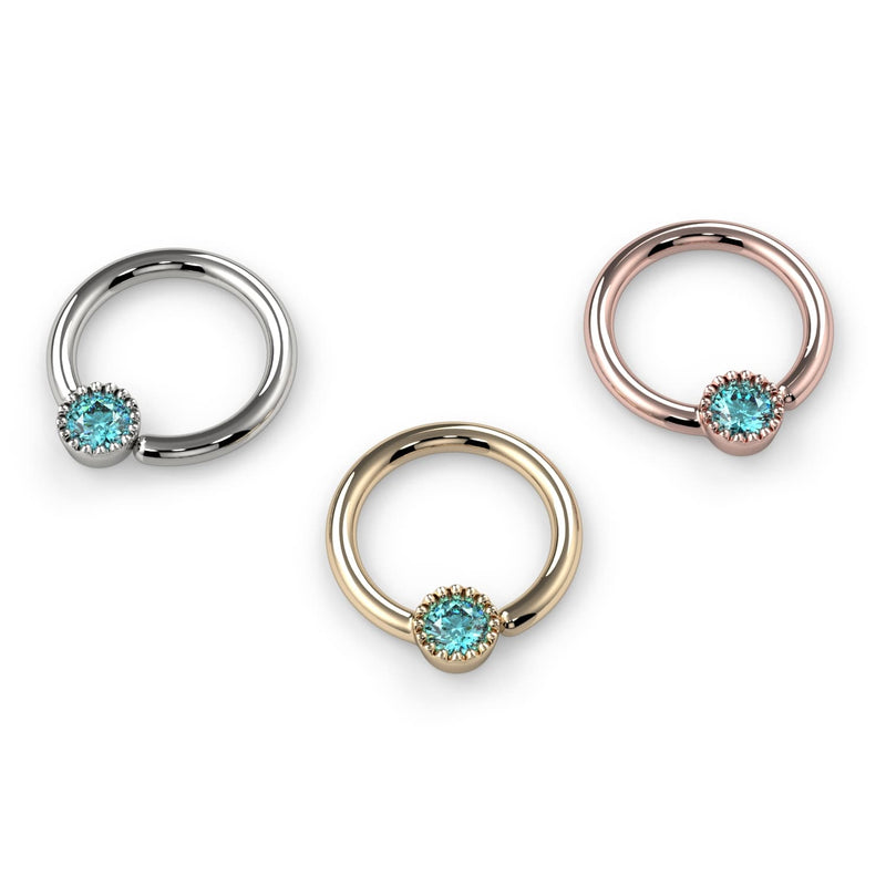 All three metal options of the aqua diamond Perlagé fixed bead ring displayed together at larger size for comparison
