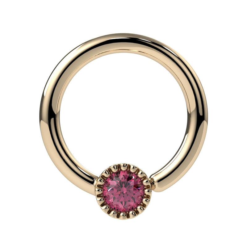 Close-up front view of 14k yellow gold pink diamond Perlagé ring highlighting the milgrain bezel detail