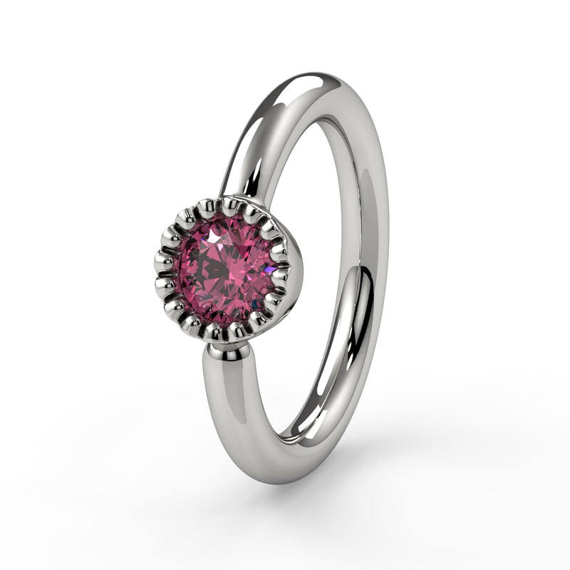 Close-up of 14k white gold pink diamond Perlagé ring highlighting the milgrain bezel detail
