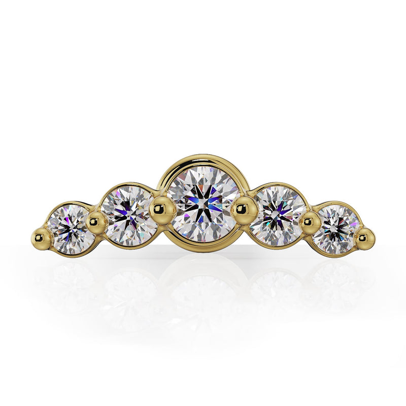 Extreme close-up of 5 graduating bezel-set diamonds on 14K yellow gold climber nose ring charm