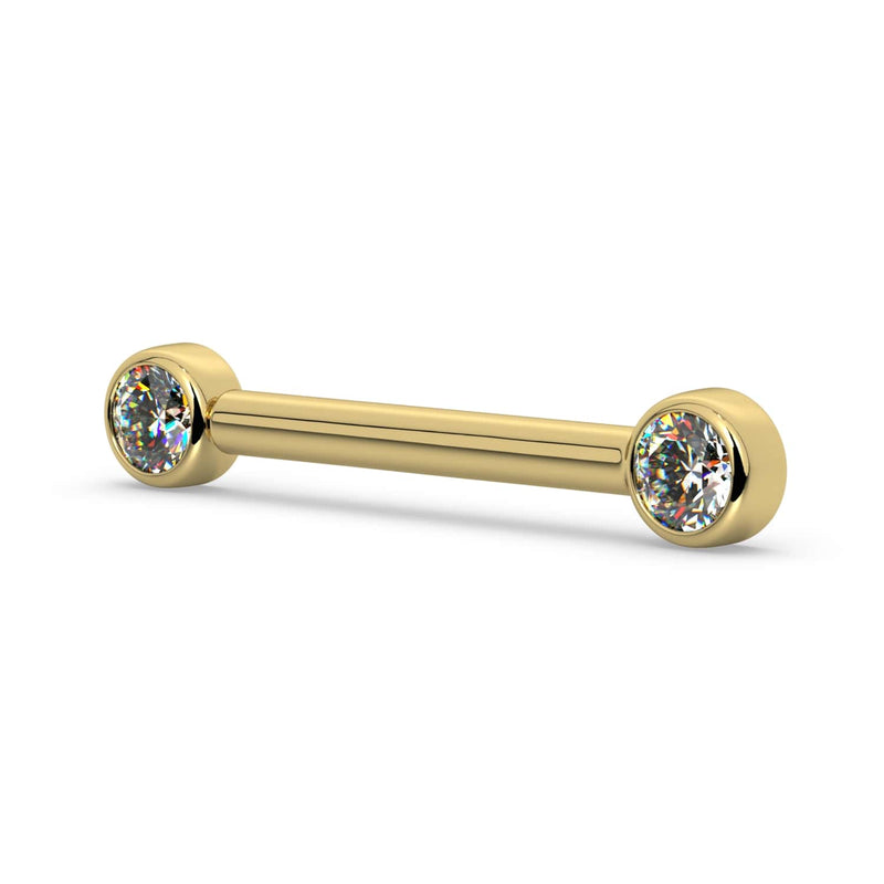 Angled side view of 14K yellow gold nipple barbell showing dual bezel-set CZ ends and bar depth
