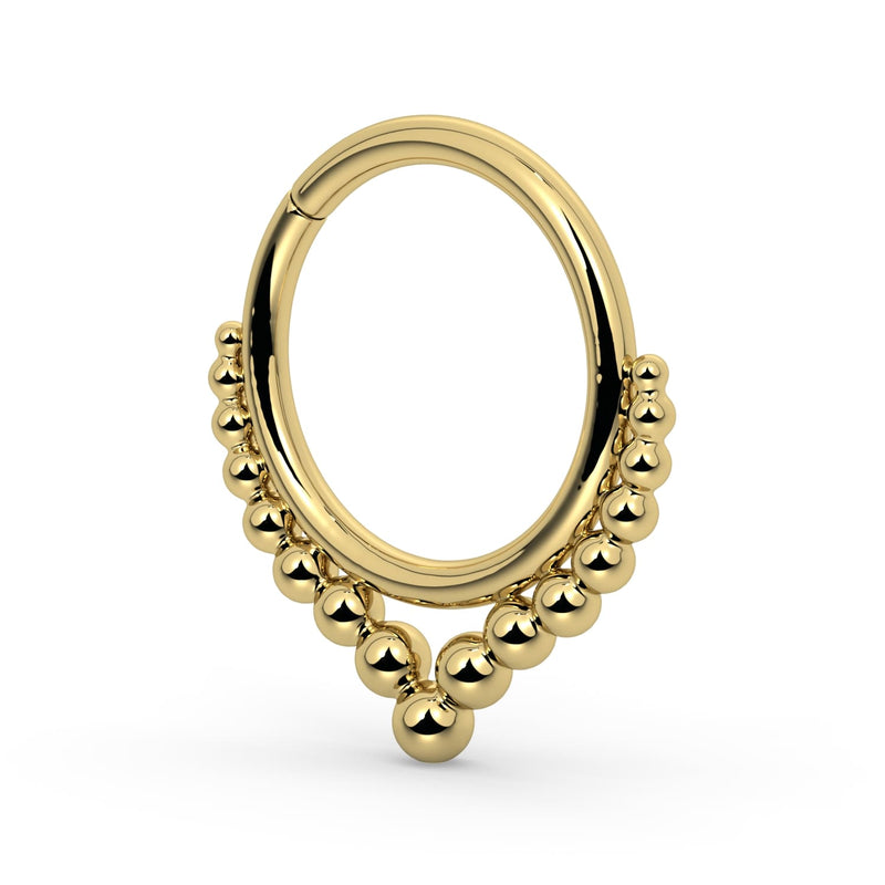 Side profile of 14k yellow gold Bali seam ring showing beaded arch detail and seamless closure