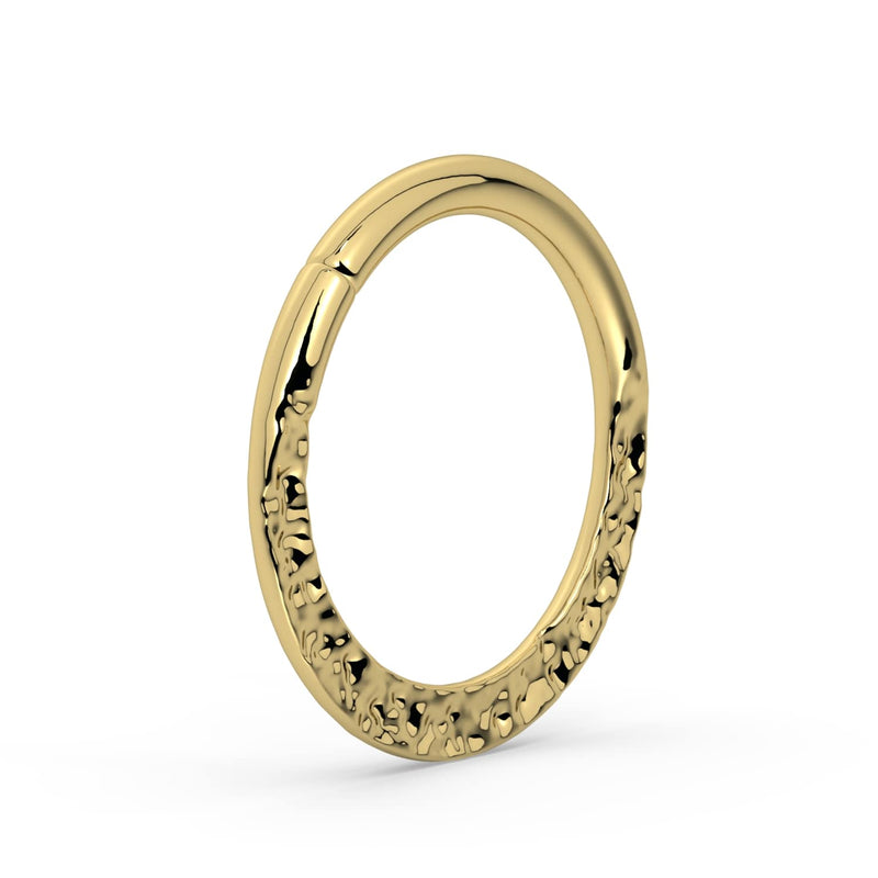 Angled view of 14k yellow gold hammered seam ring showing depth of hand-hammered texture and seam