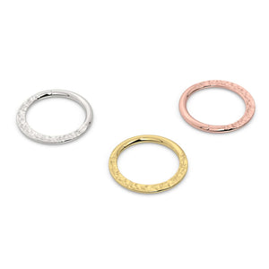 Hammered seam ring in all three 14k gold options: white gold, yellow gold, and rose gold side by side