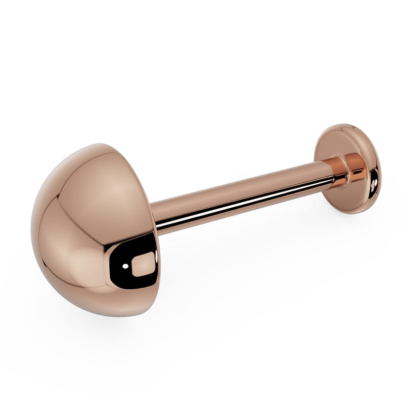 14k rose gold 5mm dome flat back labret with polished half-ball charm, angled product view