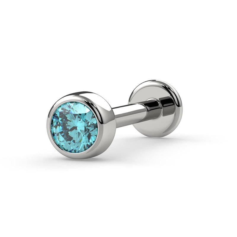 14K white gold aqua diamond bezel flat back labret stud, angled view showing cool-toned setting