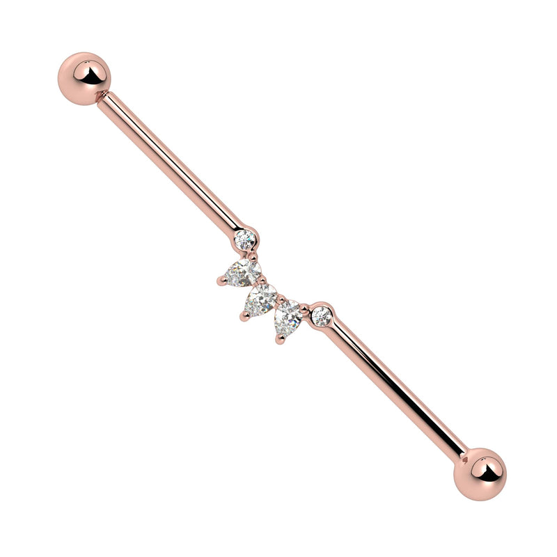 14k rose gold industrial barbell with CZ pear-cut arc cluster, front view on white background