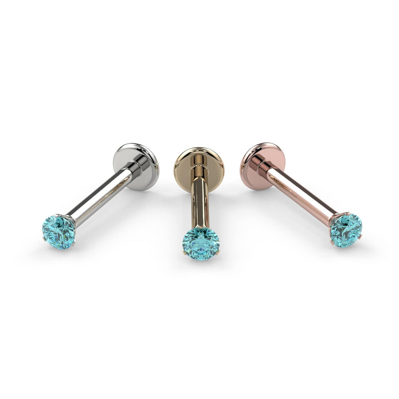2mm aqua diamond flat back labret in white gold, yellow gold, and rose gold side by side