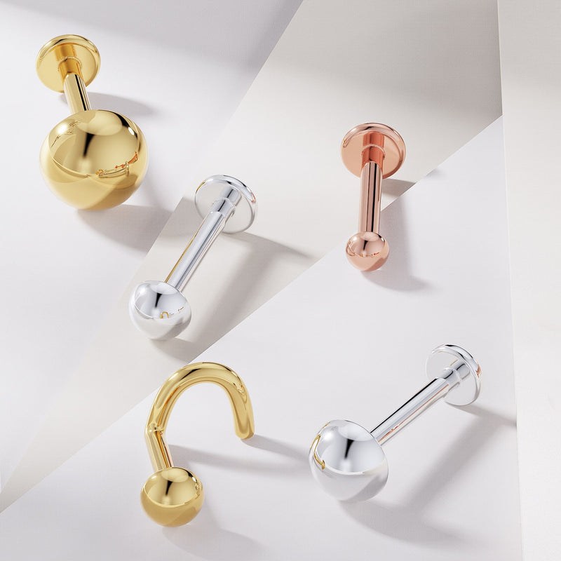 3mm dome flat back labret studs in 14k yellow gold, white gold, and rose gold shown side by side