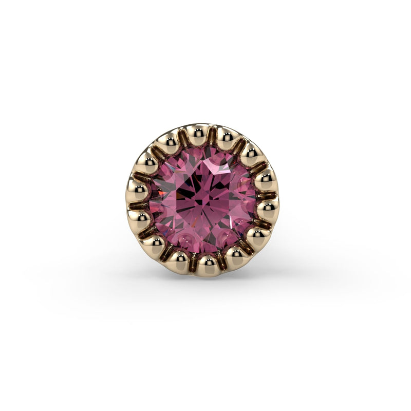 Close-up front view of 2mm pink diamond in 14k yellow gold perlage milgrain bezel setting