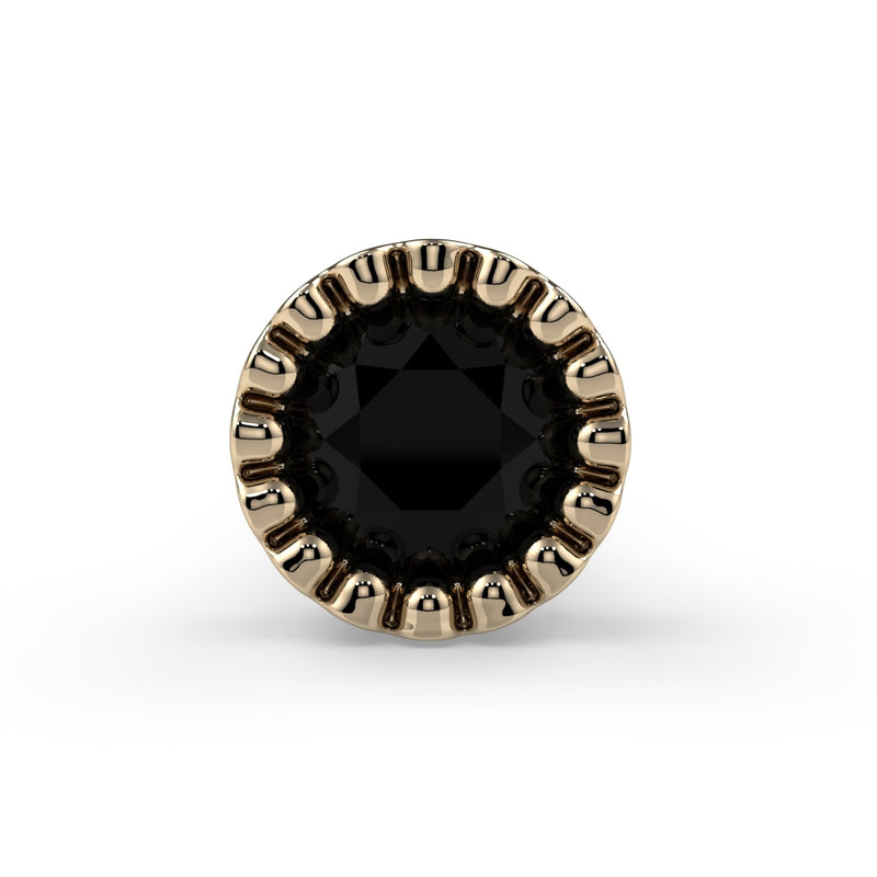 Close-up of 2.5mm black diamond in 14k yellow gold milgrain bezel setting, direct front view