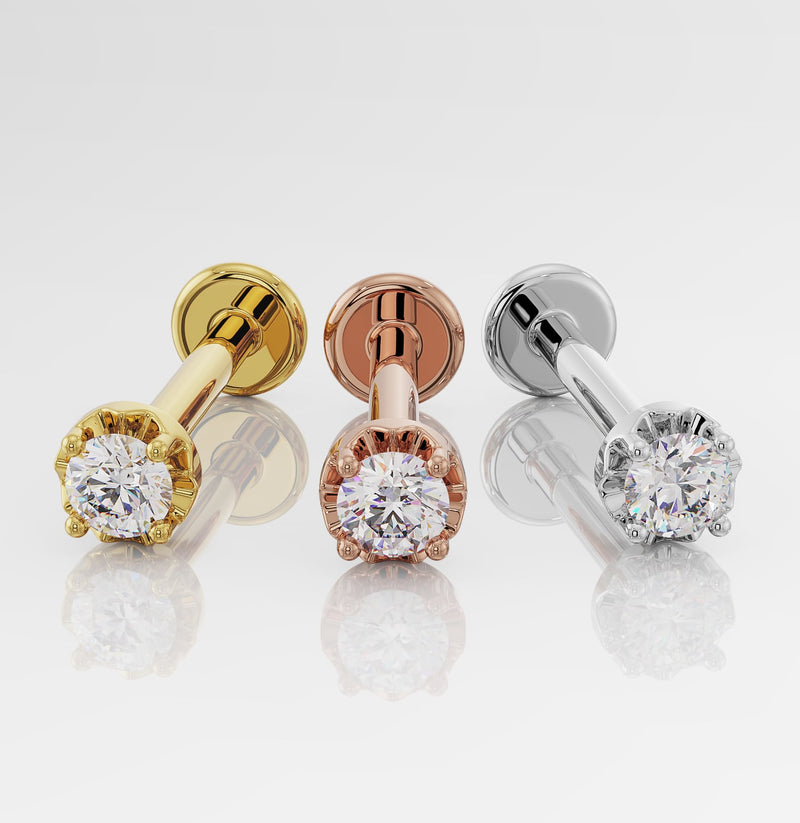 14k yellow gold, rose gold, and white gold diamond flat back labret studs shown side by side
