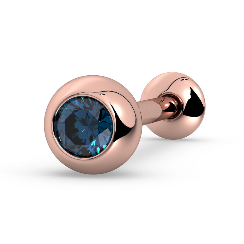 14K rose gold tongue barbell with blue sapphire bezel setting, angled view showing gem and ball end