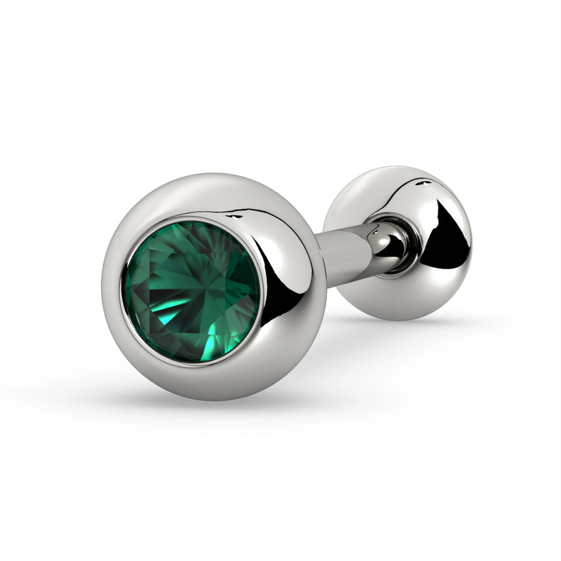 14K white gold tongue barbell with bezel-set emerald gemstone, angled view on white background