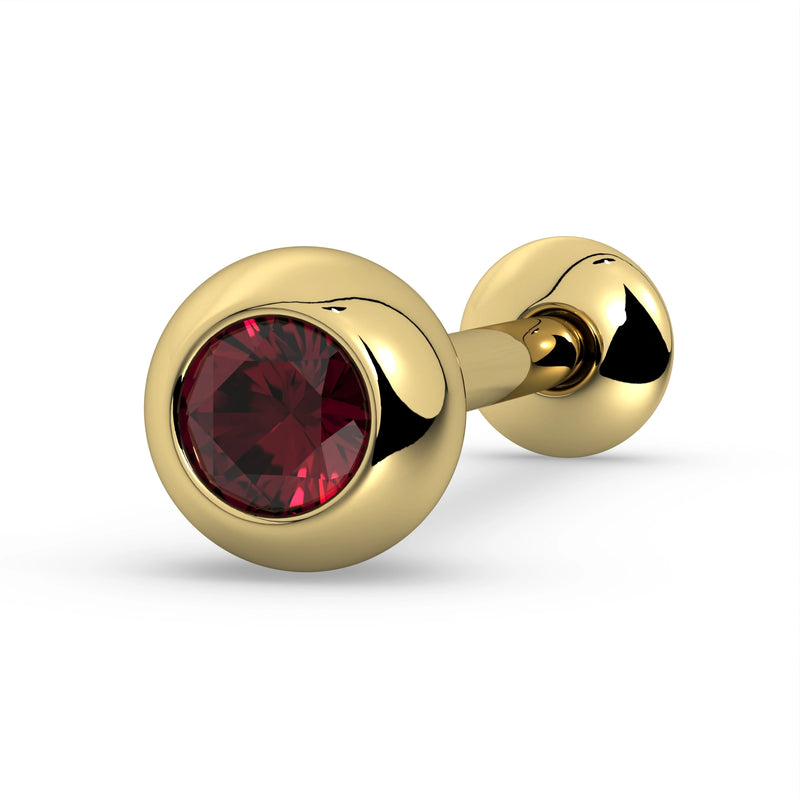 14K yellow gold tongue barbell with deep red ruby in bezel setting, close-up angled product view