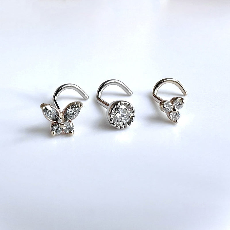 Trinity diamond nose ring shown alongside two other diamond nose studs for style comparison