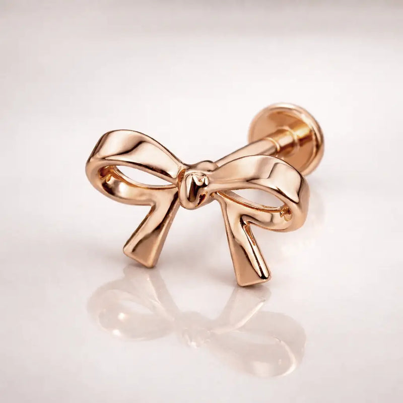 14k rose gold classic bow flat back stud, side-angled view showing push-pin closure and disc backing