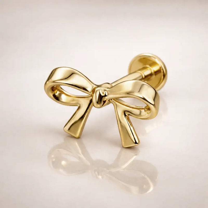 14k yellow gold classic bow flat back stud, side-angled view showing push-pin post and flat disc