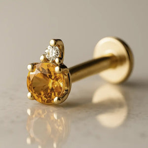 14k yellow gold citrine and diamond accent flat back labret, angled view showing prong setting and flat disc