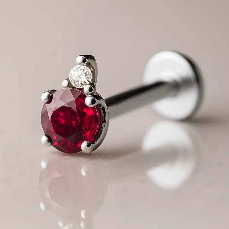 14k white gold ruby and diamond accent flat back labret, side-angled view showing prong-set ruby and disc