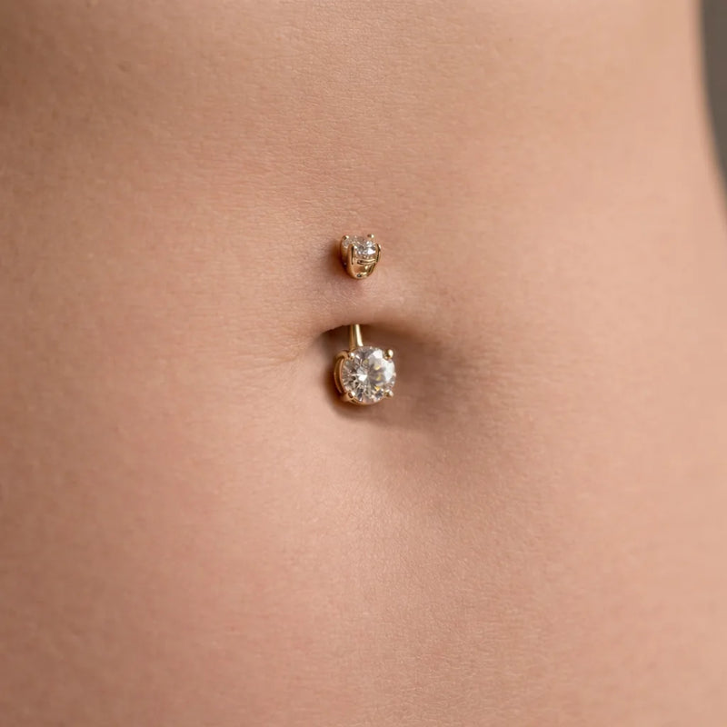 14k yellow gold 1.45 CTW diamond navel ring shown in pierced belly button for fit reference