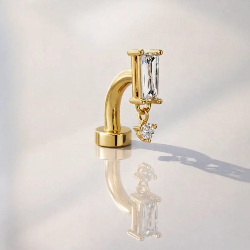 14k yellow gold baguette floating belly ring with crystal CZ dangle, styled shot with reflection
