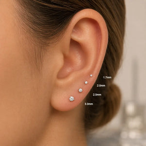 Size comparison of 1.7mm to 3.0mm diamond flat back studs worn in four ear piercings on model